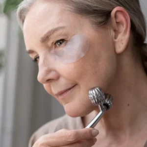 A woman wearing a white eye patch, possibly related to a cellulite treatment session.
